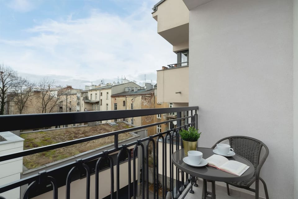 A balcony with seating, offering a charming view of the surrounding area.
