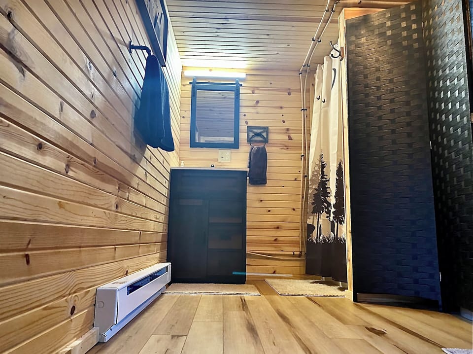 The Bathroom. Baseboard heat which is thermostat controlled in bathroom. 
