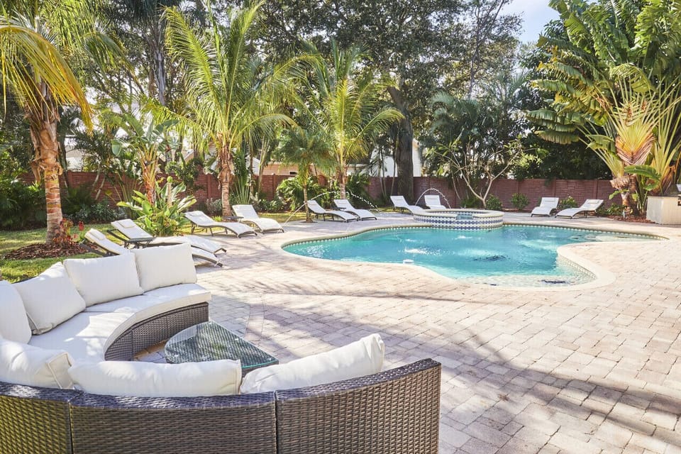 Garden style pool with group seating, lounge chairs for 10 and BBQ area