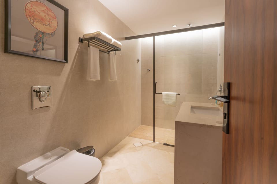 Executive Suite | Bathroom | Bathrobes, slippers, towels