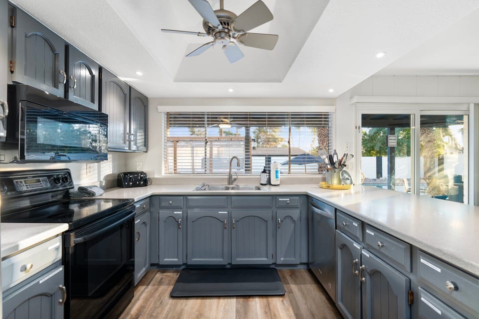 The kitchen is fully stocked with everything you need to cook and clean.