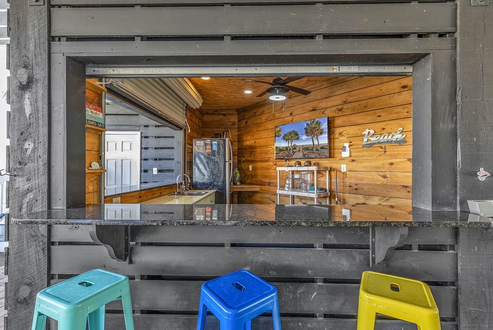 Private Bar with Large Smart TV, Bluetooth Speaker, and a Full Sized Refrigerator