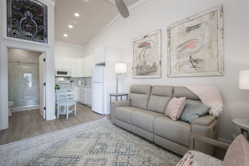 Comfortable Living Space with Italian Leather Couch adjacent to the kitchen 