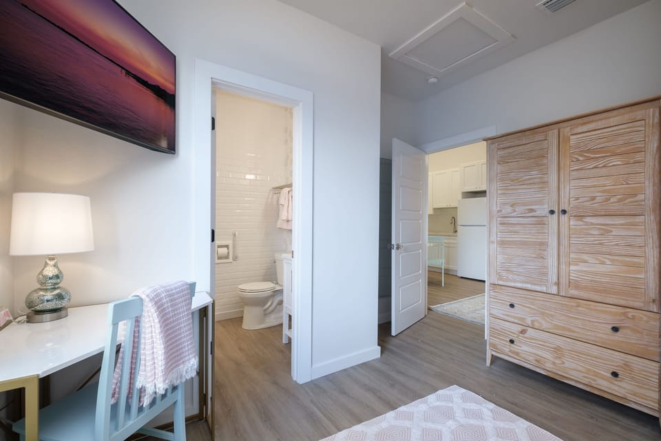 Bedroom with cabinet bed and ensuite bathroom