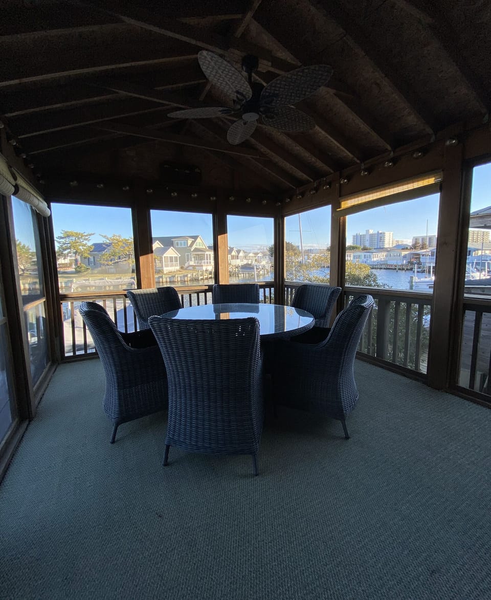 Back porch with seating for 6 and a beautiful view. 