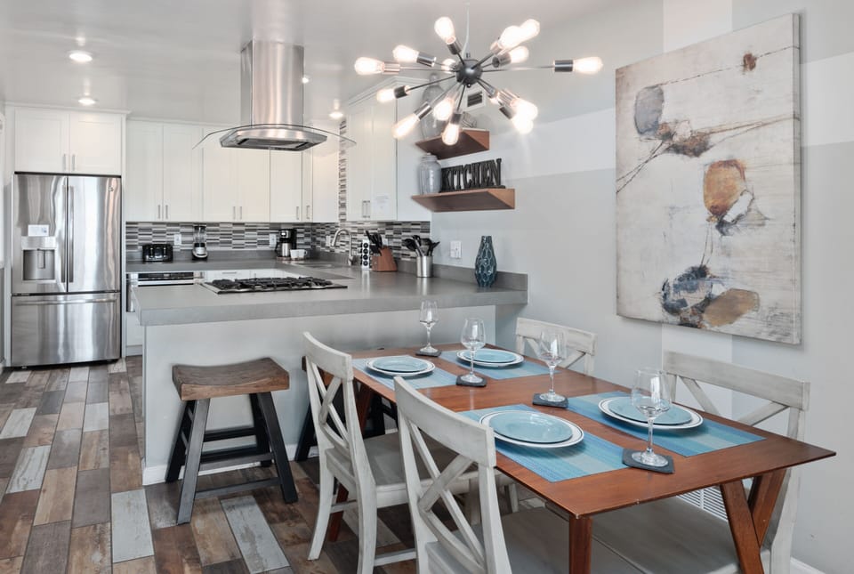Fully equipped kitchen with high-end appliances, premium cookware, and quality utensils.