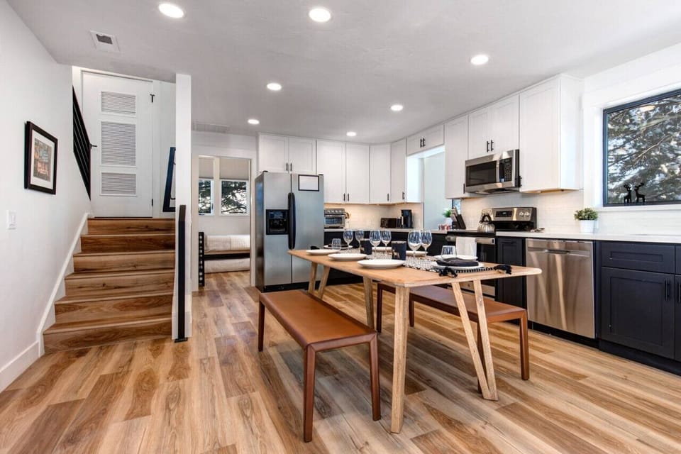 Great room with dining area. You can see the small twin room and the stairs leading up to the master bedroom