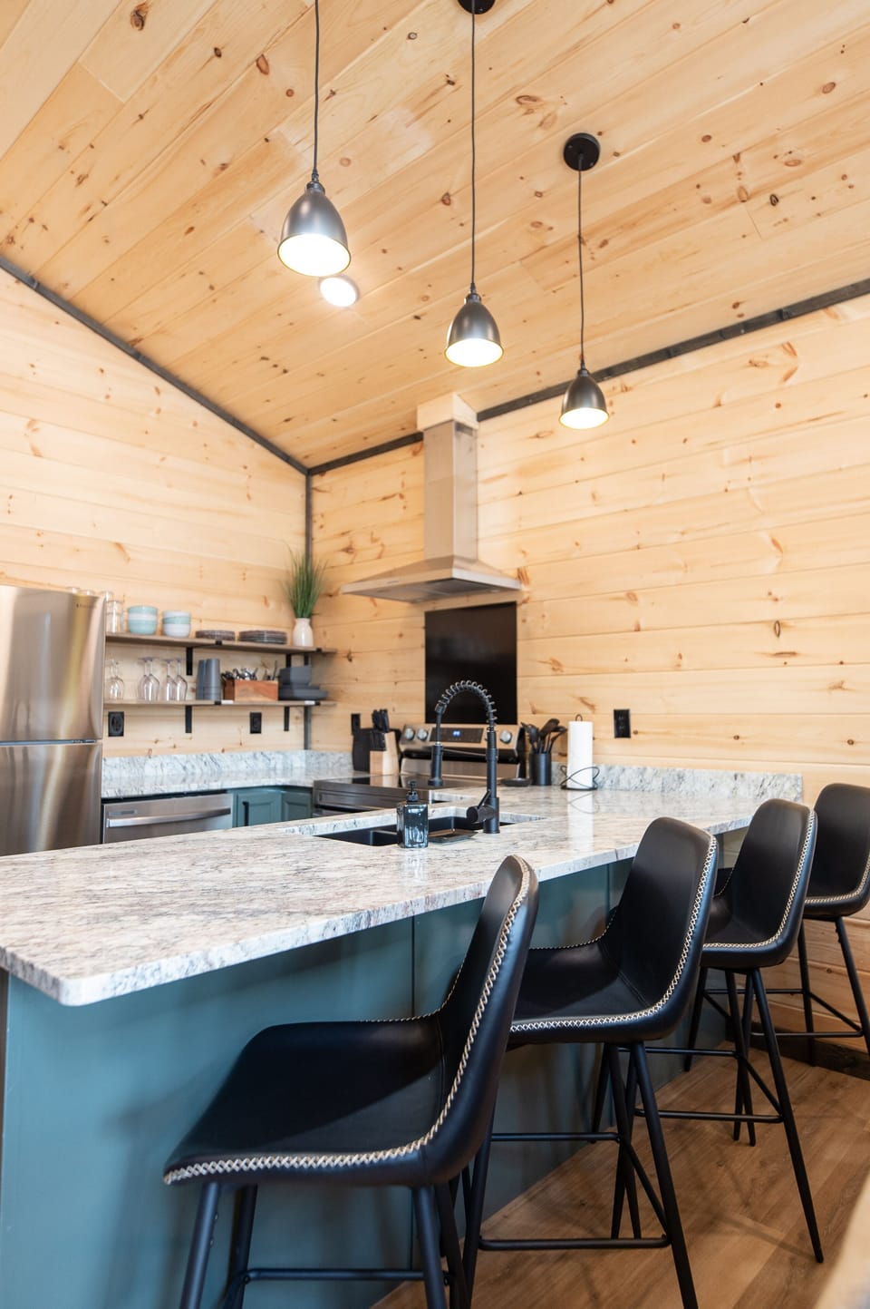 Fully stocked kitchen including cooler for park days and a crockpot to make sure meals are ready after a long day of exploring 4 Bar size chairs for your comfort while eating at the bar. All the comforts of home at your destination.
