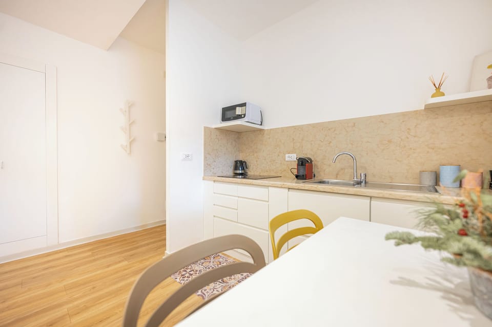 Comfort Apartment | Private kitchen | Full-size fridge, microwave, cookware/dishes/utensils, cleaning supplies