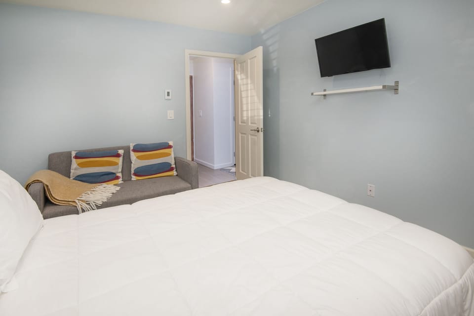 3rd Bedroom with TV and Hanging Clothes Storage (1st Floor)