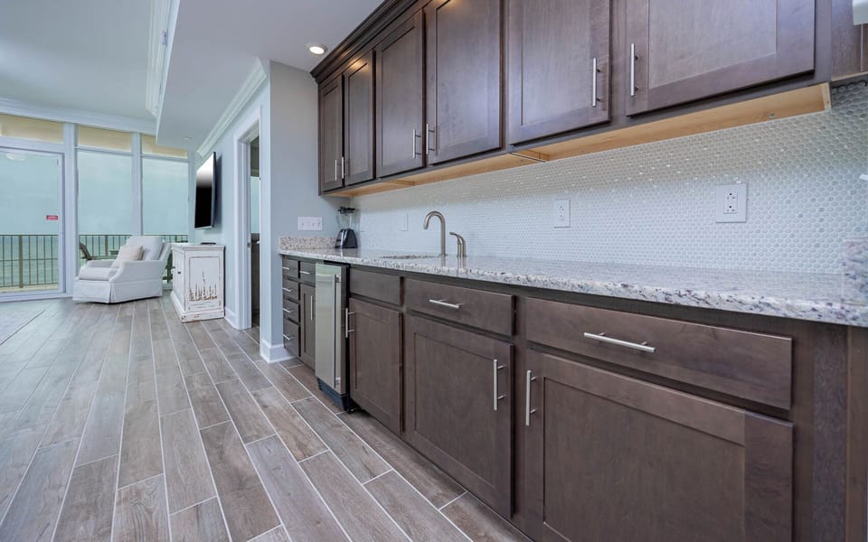 Fetch a chilled drink from the wet bar and enjoy gulf views through the balcony's sliding glass doors