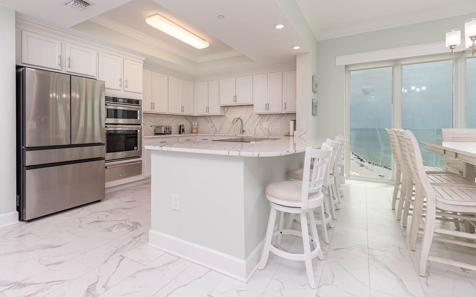 Savor your morning coffee or an evening meal from this upgraded kitchen and stunning views of the beach