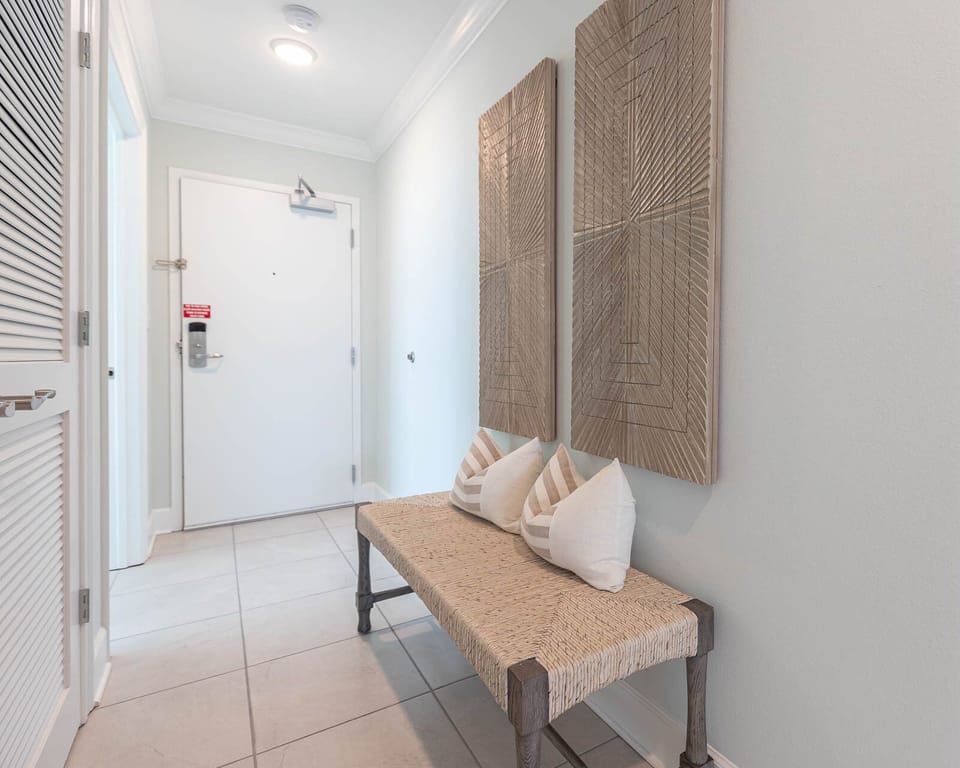 Welcoming entryway invites you to explore this charming vacation rental on the beach