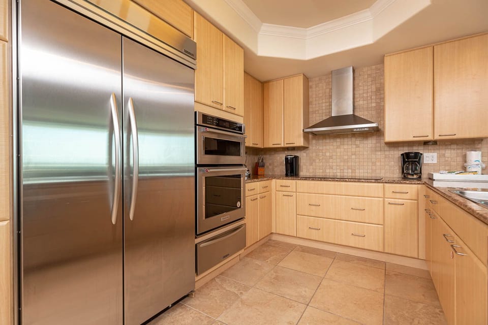 This kitchen features modern stainless appliances, granite countertops, and a spacious layout perfect for culinary adventures
