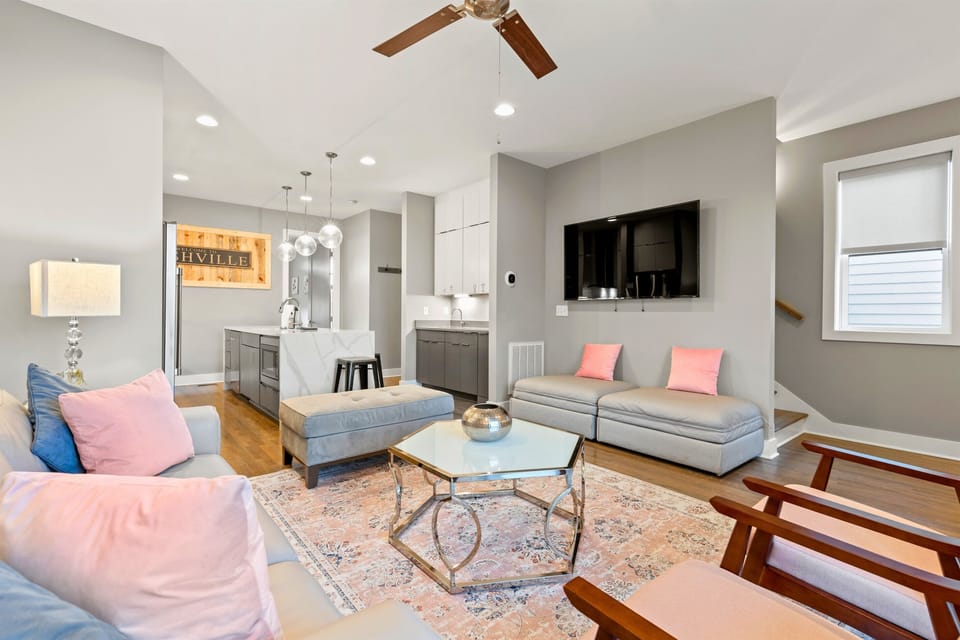 Enjoy your favorite movies, sports, and shows on Casa Rosalie’s living-room TV. This cozy living room provides extra sleeping space with two twin pull-out beds