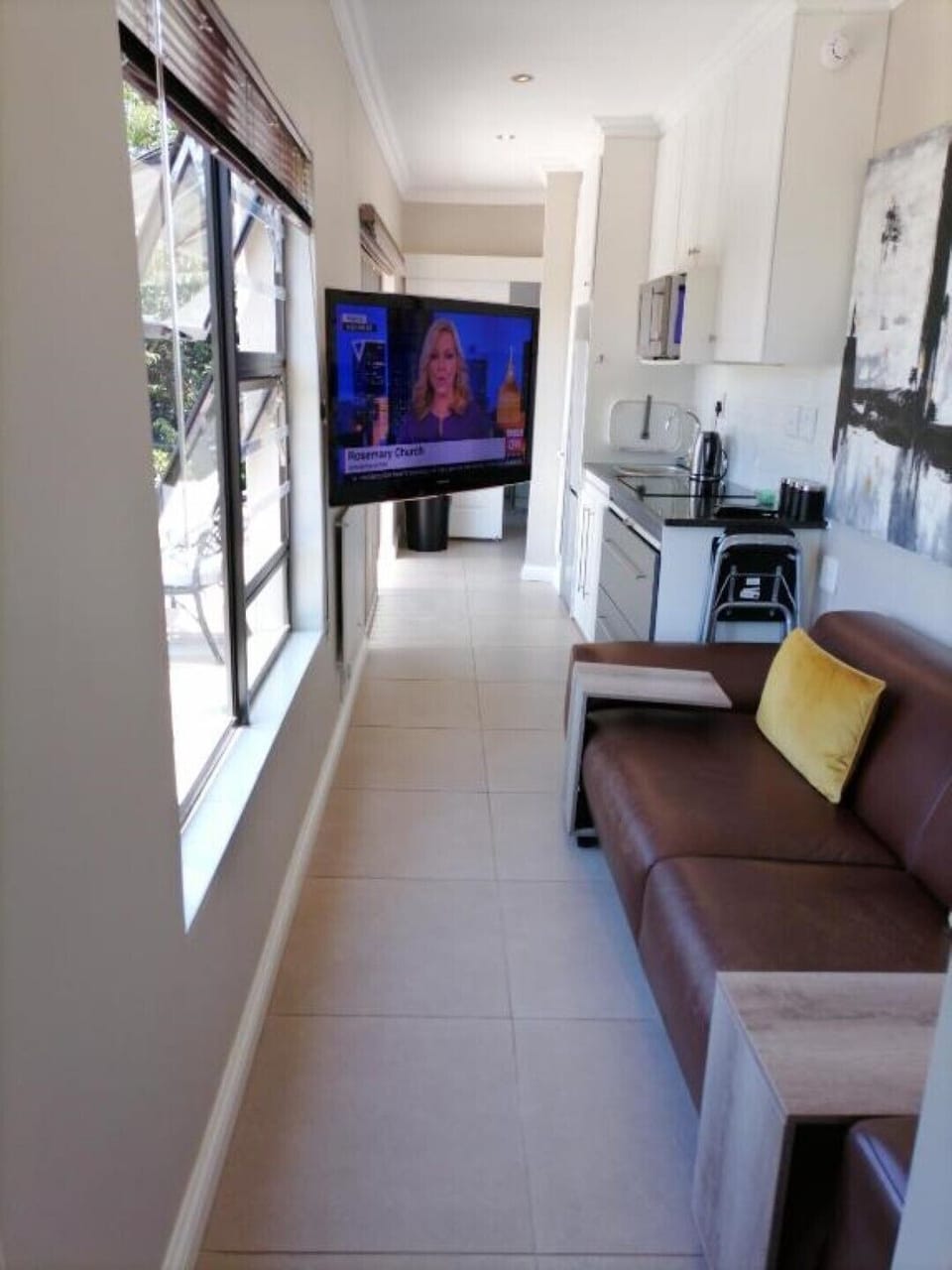 Tv mounted on swivel bracket for easy viewing.