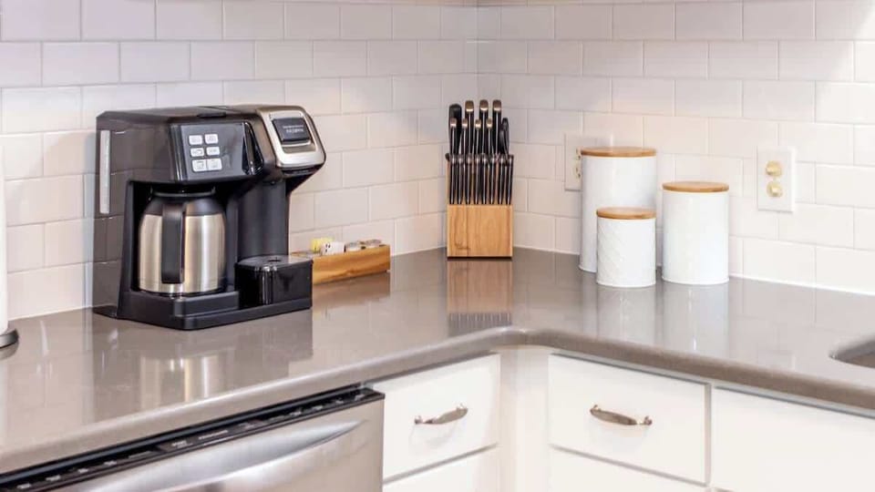 Our all-in-one coffee maker lets you brew a single cup or a full pot using either K-cups or ground coffee. We provide a starter supply of K-cups, sweeteners, and creamers to get you going.