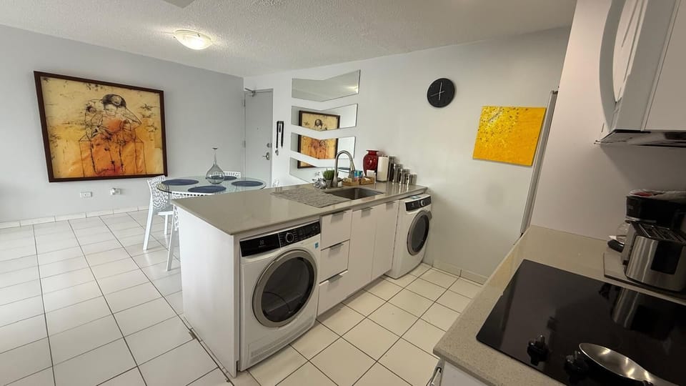 open kitchen with in house washer and dryer