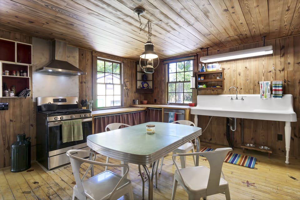Kitchen with brand new appliances and restored cast iron sink. 