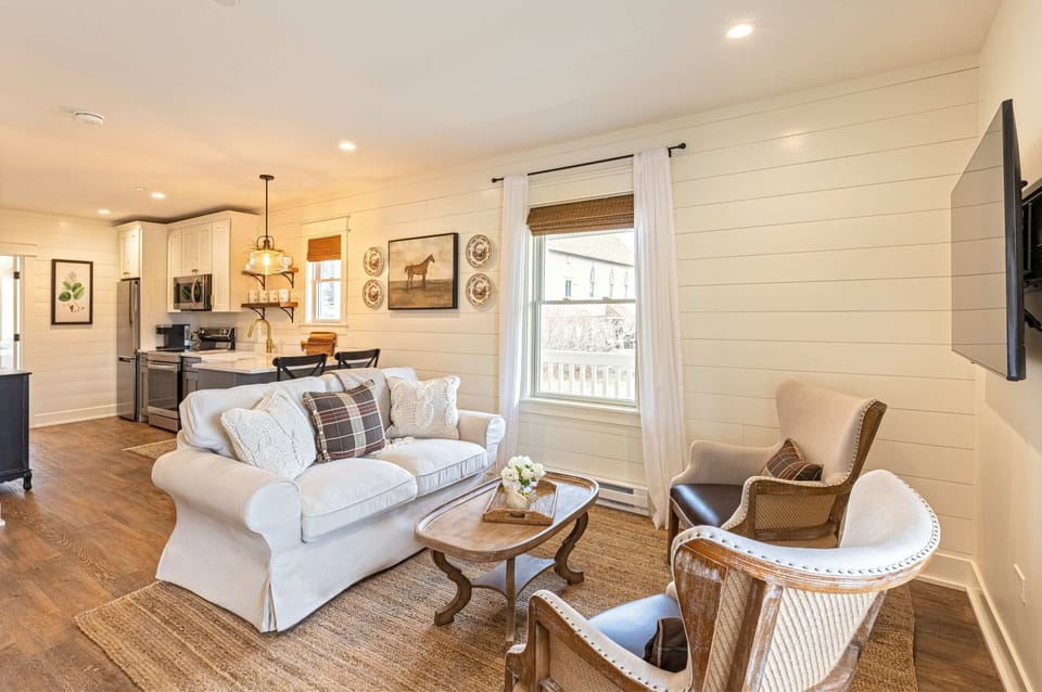 A light-filled living space where shiplap walls and farmhouse charm set the tone.