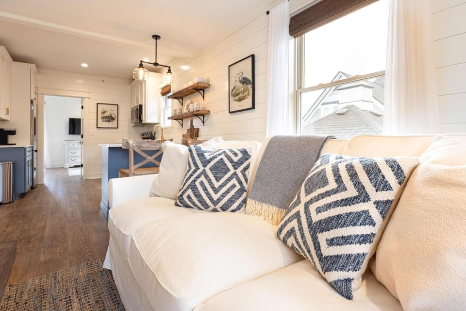 Sink into the sofa and stay a while - this space was made for it.