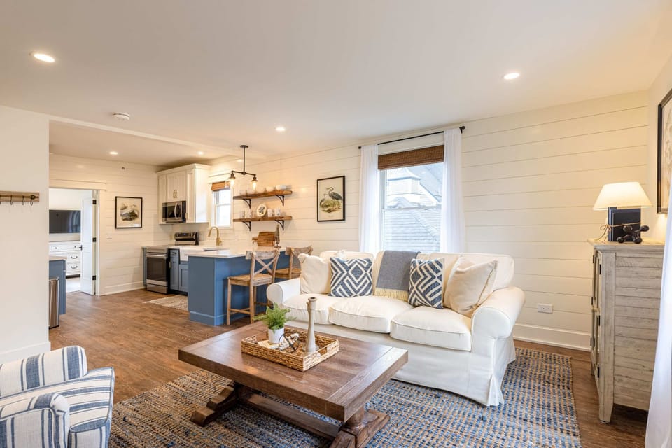 A second angle of the living room - spacious, warm, and full of natural light.
