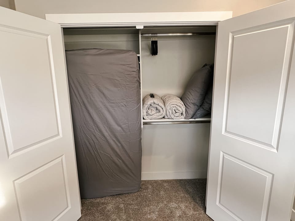 Extra Twin mattress with extra pillows and blankets