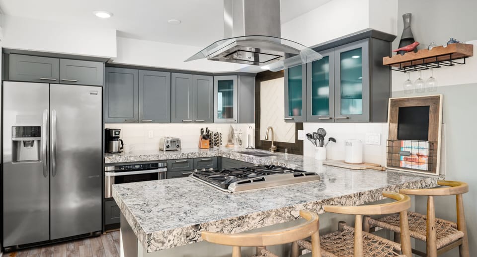 Enjoy marble countertops, high-end cookware, and all the essential utensils for a comfortable stay.