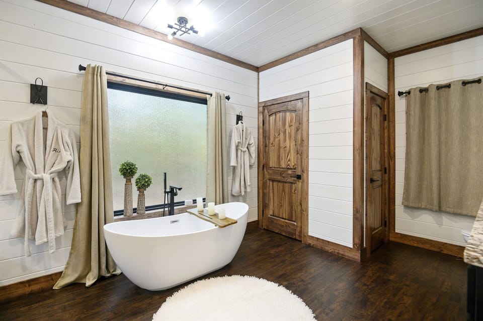Bath Retreat: Relax in a freestanding tub surrounded by elegant decor and soothing natural light!