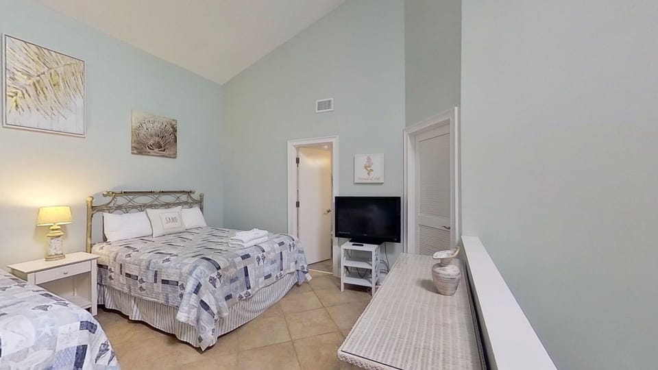 2 Double Beds. Loft Bedroom at top of spiral staircase. Private Bathroom and walk in closet attached.
