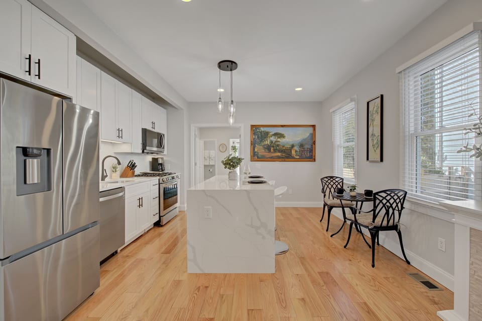 Fully stocked kitchen with brand new appliances and seating for 4.