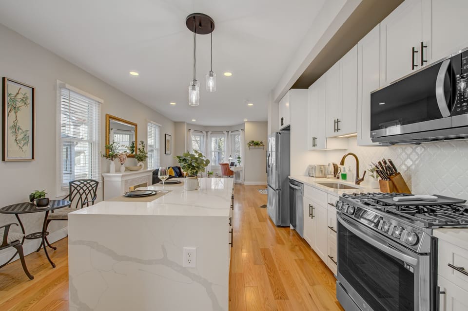 Fully stocked kitchen with brand new appliances and seating for 4.