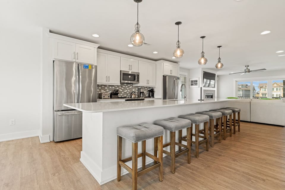 Kitchen with Bar Stool Seating on Third Level