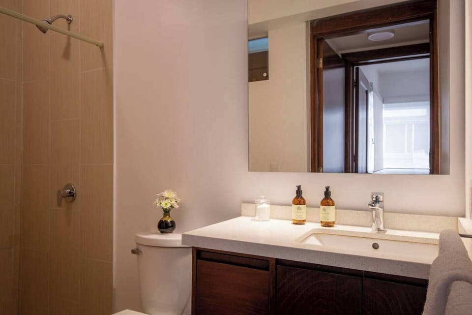 
Step into the bathroom, where a rejuvenating shower awaits, complemented by a selection of high-quality bath products thoughtfully provided to enhance your well-being and indulgence.