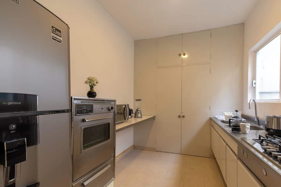 The state-of-the-art kitchen stands as the heart of the home. Equipped with top-notch amenities and sleek finishes, it's a culinary haven ready to inspire your inner chef. The wide window beside it not only infuses the space with natural light but also offers a soothing view as you create culinary delights.