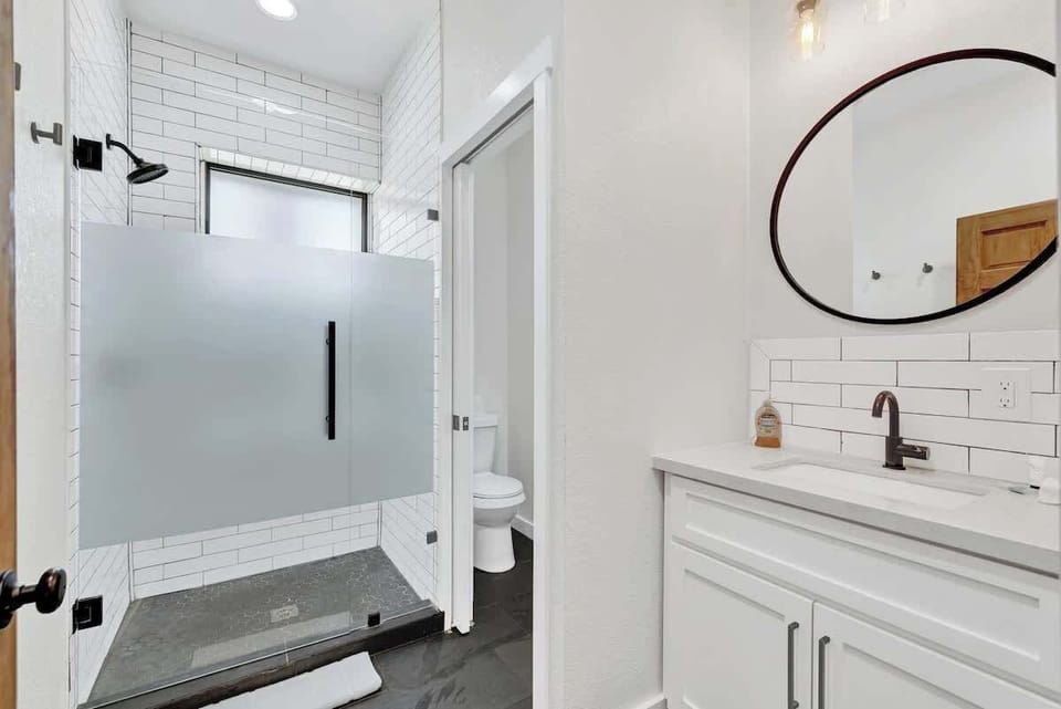 Bathroom two with beautiful tiled shower.