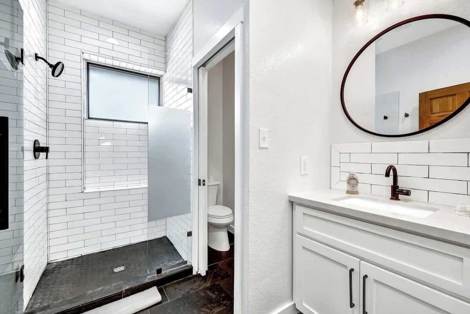 Bathroom one with a walk in shower.