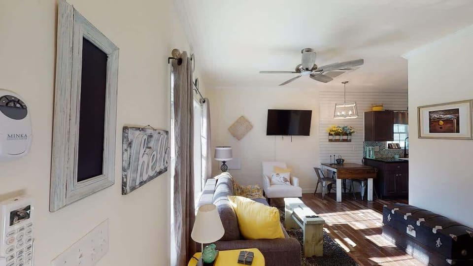 Socialize or play provided board games in this spacious, airy room with ceiling fan and natural light streaming in. 
