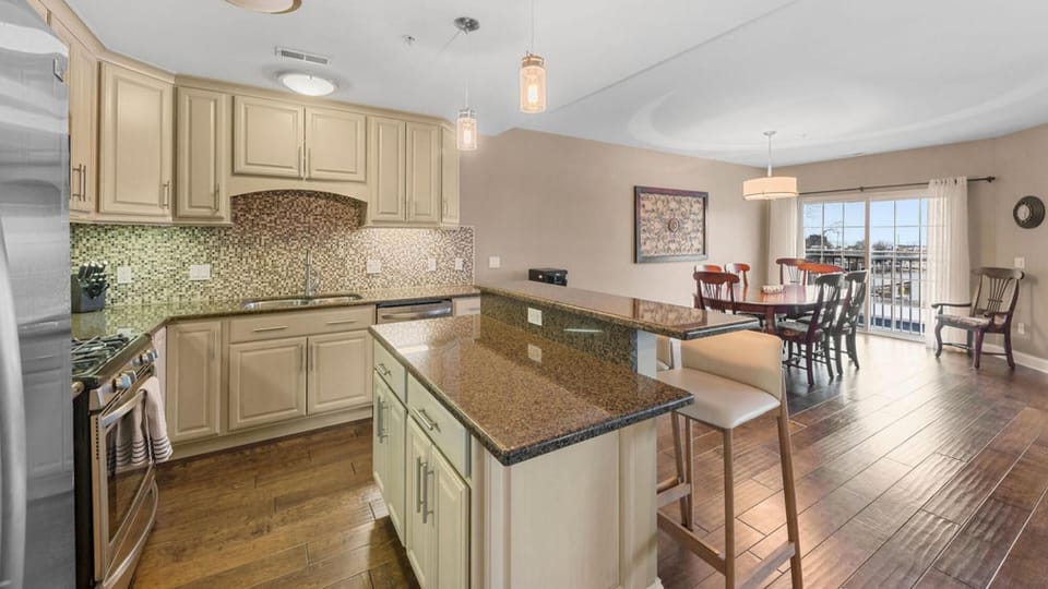 The kitchen is open to dining and living areas