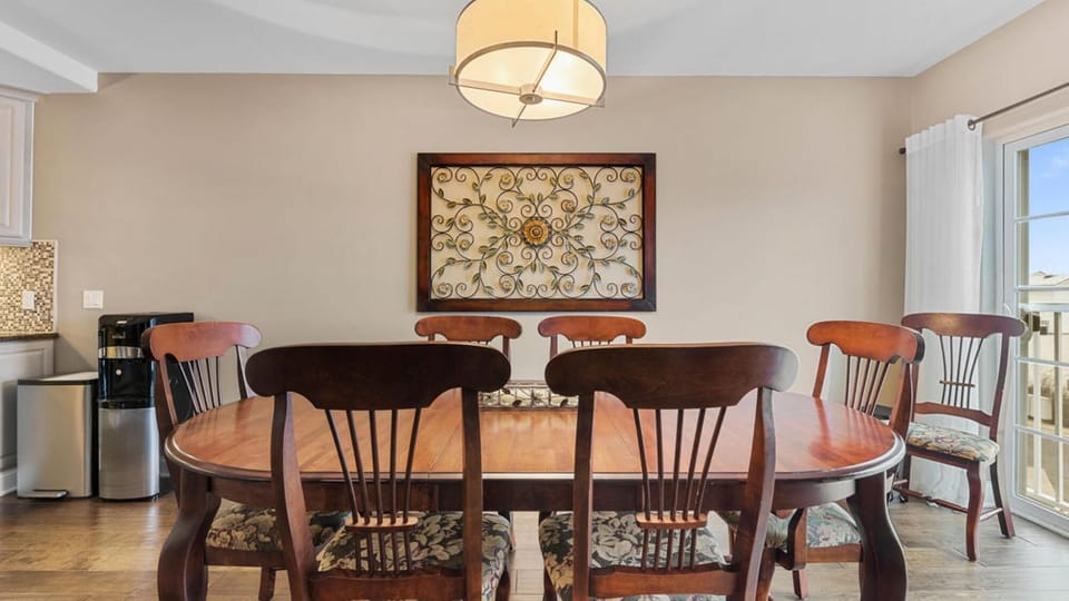 Dining area with ample seating and balcony views