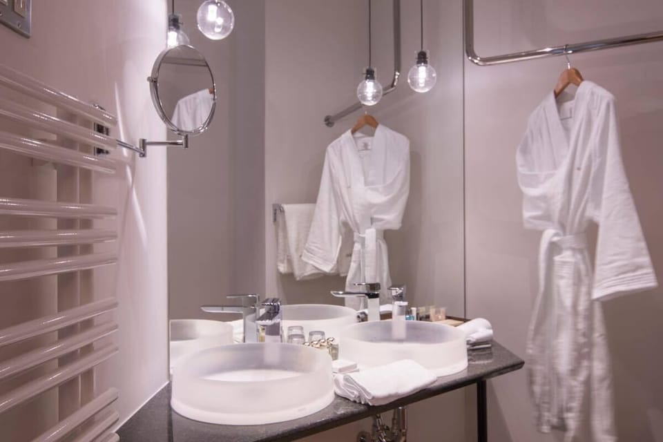 Separate tub and shower, designer toiletries, hair dryer, bathrobes