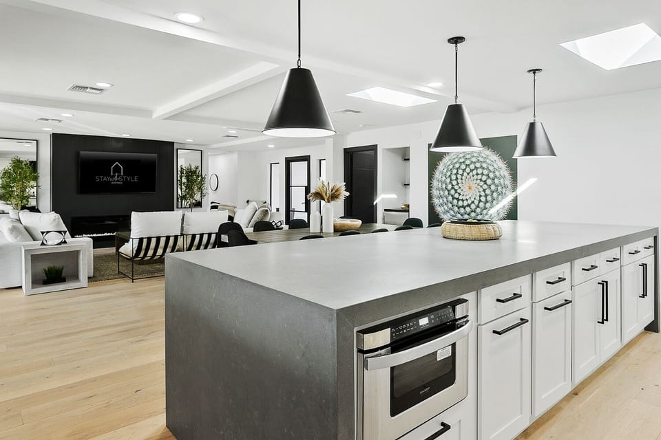 Open floor plan, gourmet kitchen overlooking living space