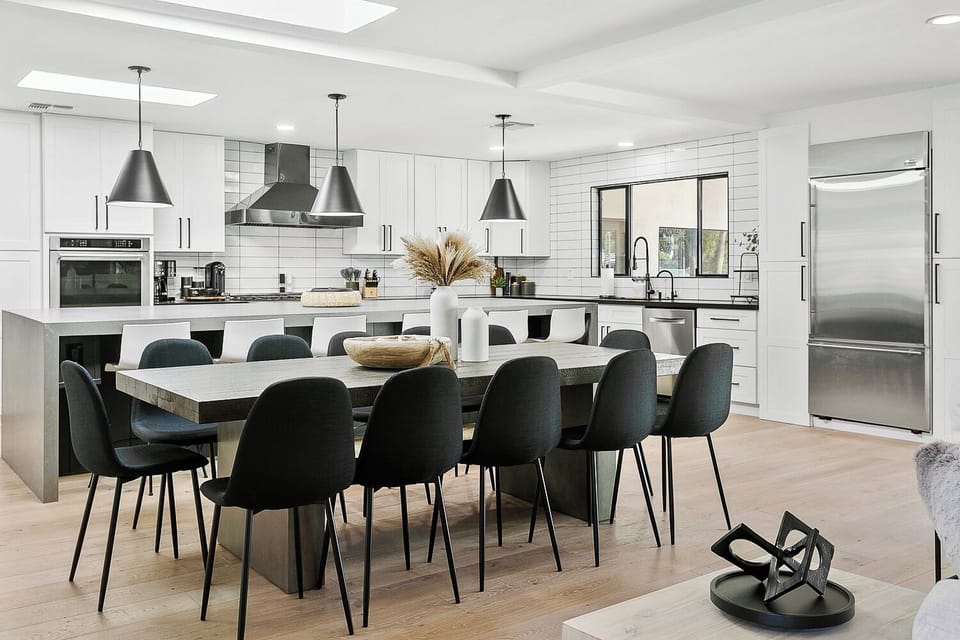 Open concept dining room with 12 chairs