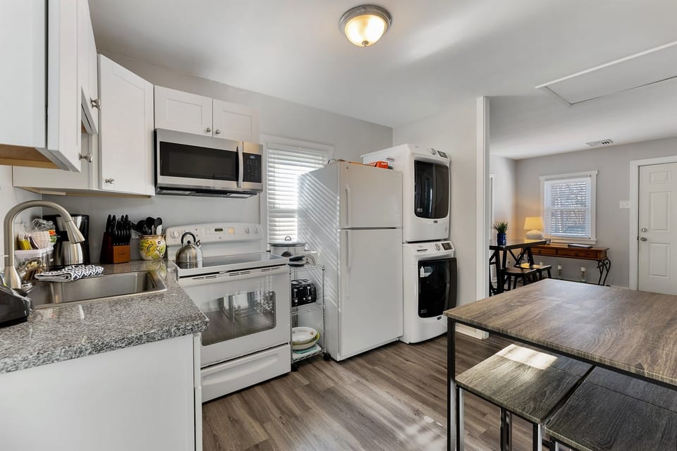 "Cook up comfort in this fully stocked kitchen – includes crockpot, coffee bar, and more.
