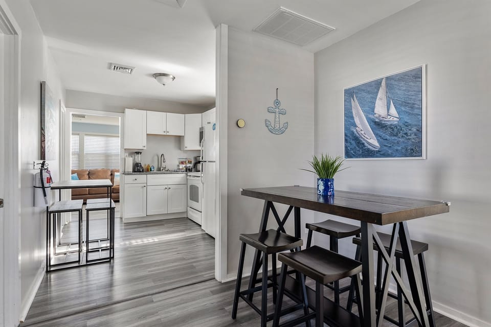 "Open dining space with nautical charm – gather for meals or plan your Cape May adventures."