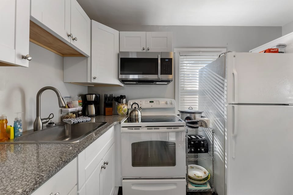 "Full-size fridge, freezer, stove, and all the essentials to make cooking easy and convenient."
