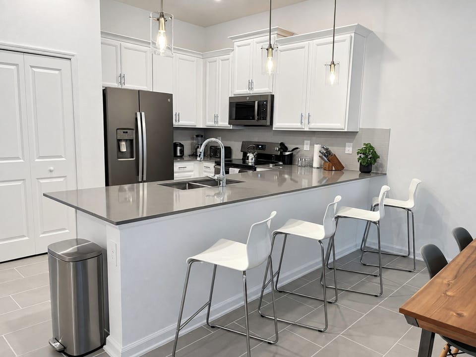 Modern Kitchen with Breakfast Bar and Stainless Appliances