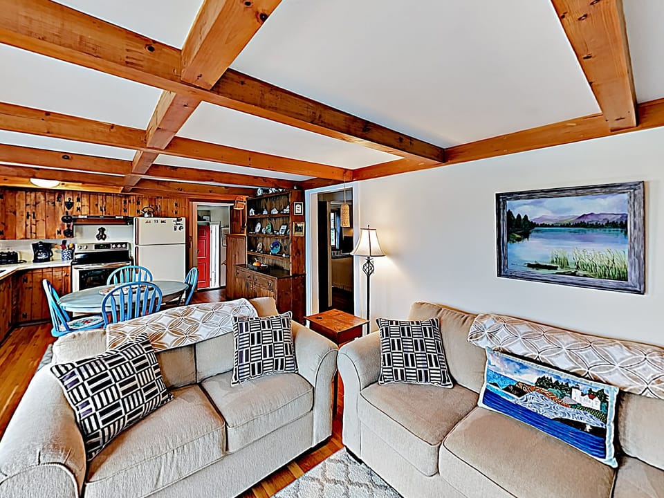 The living room, dining room and kitchen are open concept with a great view of the ocean.
