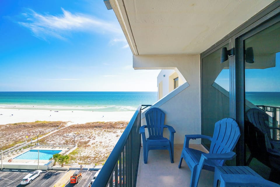 Relax in your cozy chairs on the balcony while taking in the stunning coastal views and gentle sounds of surf
