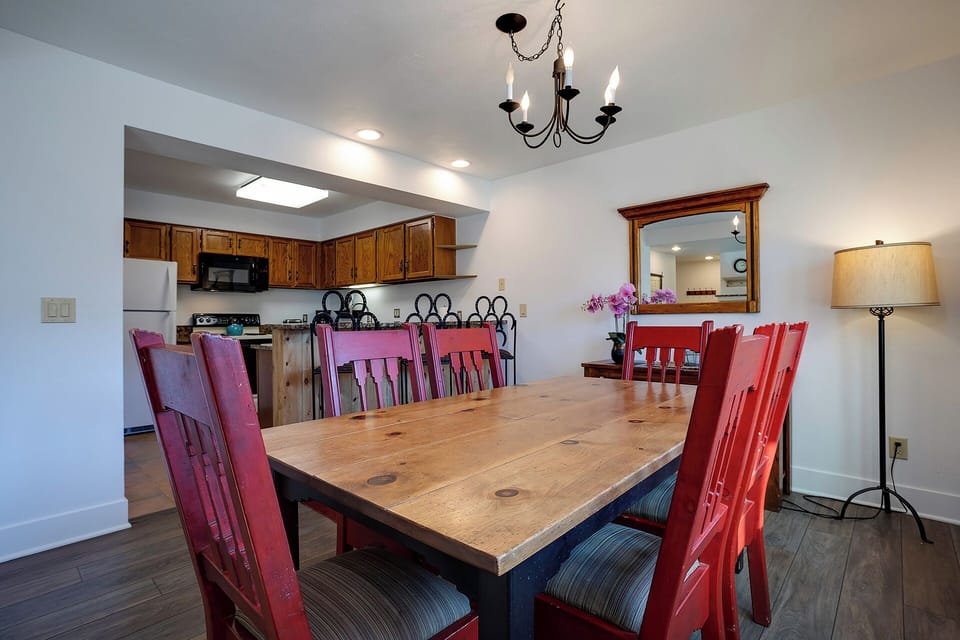 Gather around your spacious dining table for memorable meals, with a fully equipped kitchen ready for your culinary adventures.
